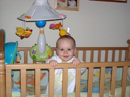 Keegan standing in his bed