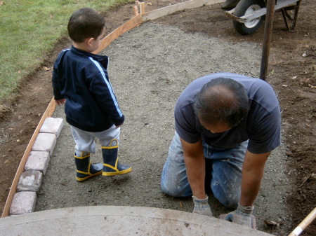 Ben and Aydin putting in a new walkway in front