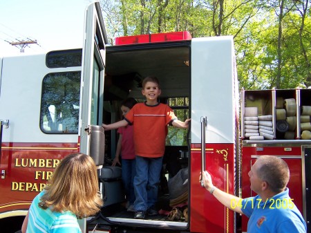Tyler on the firetruck!!