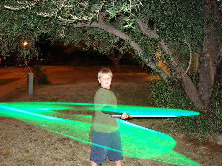 My son playing with his Lightsaber in the dark
