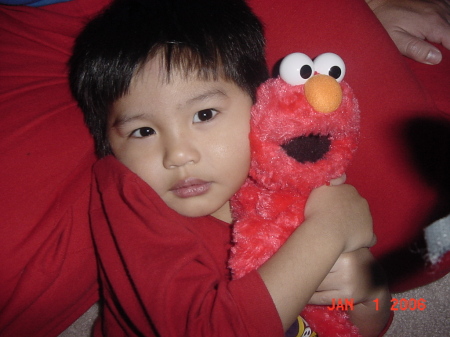 Allan hugging Elmo