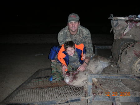 My husband & son with his 1st deer