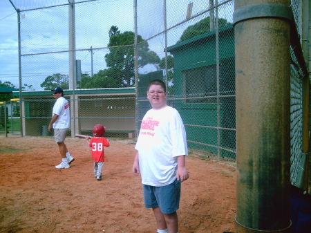 Kyle playing baseball