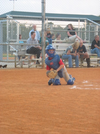 Timothy catching Little league game