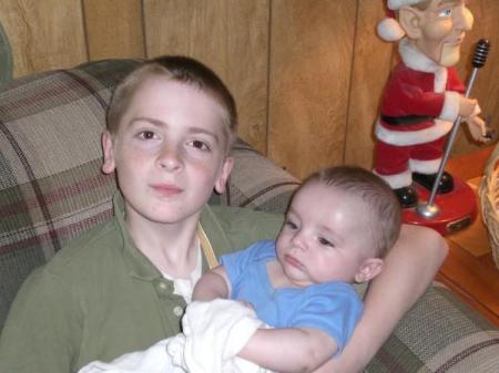 My youngest son Alma holding my grandson.