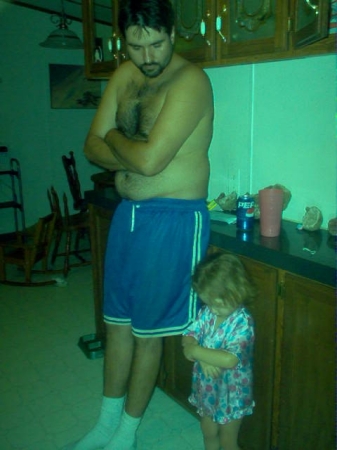 my man mike and our 2 year old (acting like daddy) lol