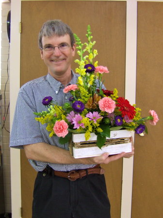 Mike with flowers at Mom's funeral, 2006