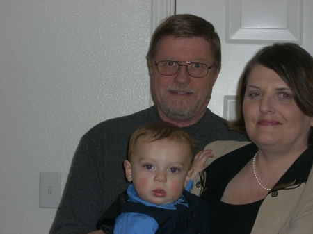 My usband Ron and I with our grandchild Cole.