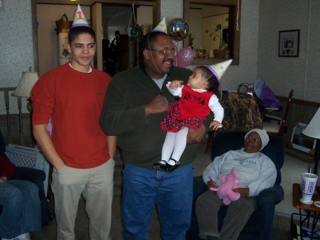 My son Tony, husband Chris and Maddie on her 1st birthday
