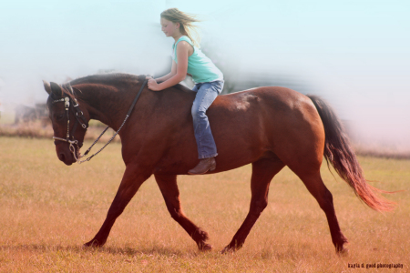 My granddaughter Carlye on one of our 8 horses