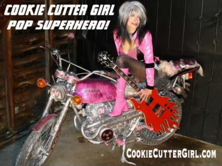 cookie_cutter_girl_pop_superhero_endorses_minarik_guitars_bike_poster