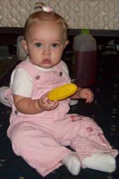 Kelly Eating Her First Piece Of Corn