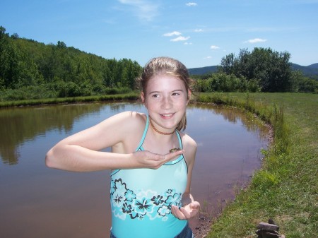 My 12 year old daughter, Abby, holding the frog she just caught out of the pond