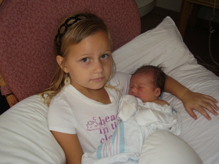Our baby daughter with her big sister.
