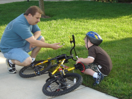 Little J learns to fix his bike with Daddy....