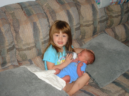 Zoe feeding Caleb