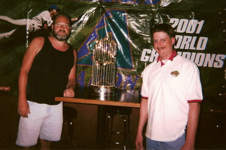 World Series trophy and  a golfing buddy.