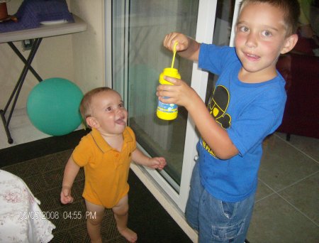 Brothers blowing bubbles