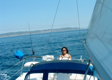 At the helm on our Sailboat