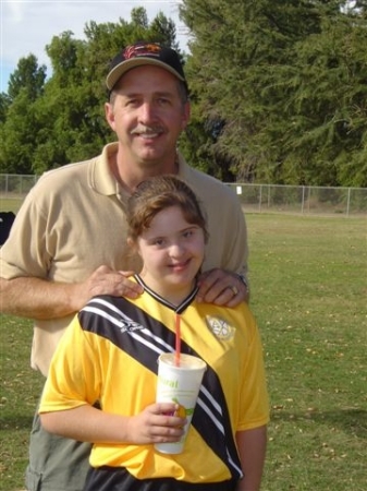 Taylor and dad at her soccer game.