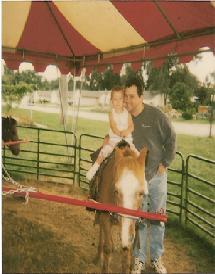 Gena at about 2 years old riding a pony