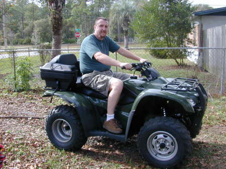 John on Brandon's ATV