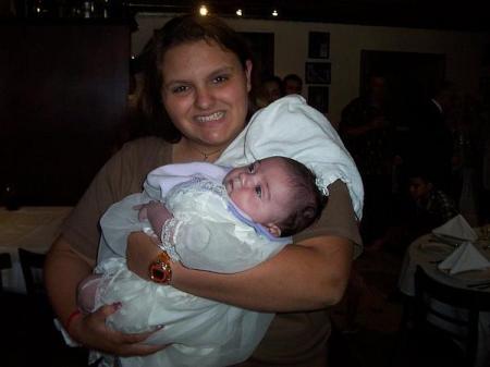 MY DAUGHTER HOLDING MY NIECE ON HER CHRISTNING