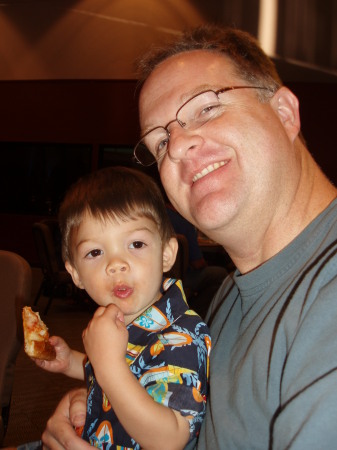 Grant and Daddy munching on pizza
