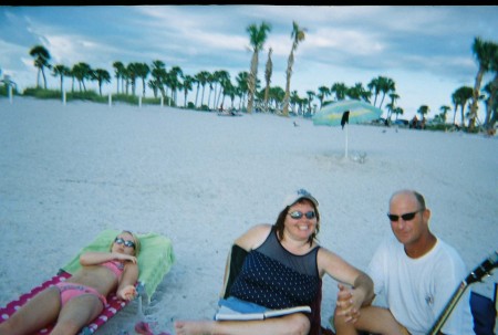 My husband, step-daughter and me on the beach