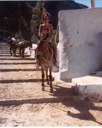 Riding a donkey in Santorini, Greece