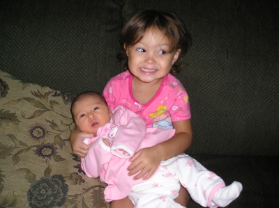 Big sis Trinity holding baby sis Savannah