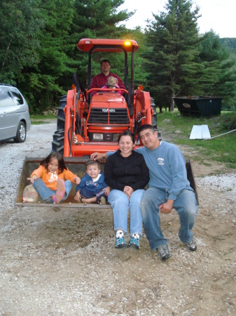 The four of us on a tractor in Vermont.