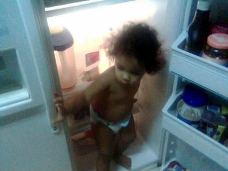 Christian standing inside the fridge.