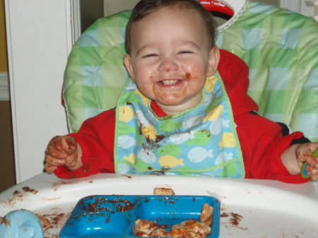 Tyler loving the chocolate pudding.