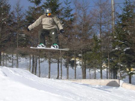 dad snowboard jump