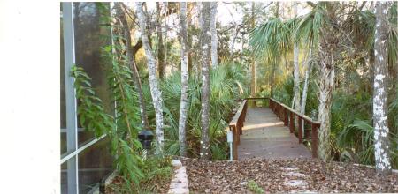 raised walkway through backyard to dock