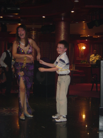 "A chip off the old block" Son Michael charming the belly dancer on our Nile Cruise. April 2006