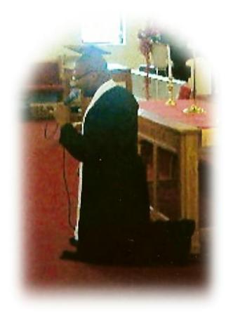 pastor brown preaching kneeling