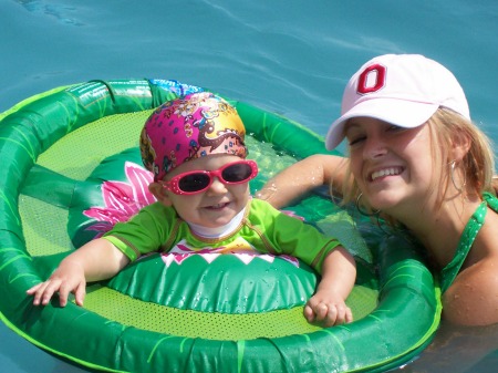 Addie and Alissa chillin' in the pool