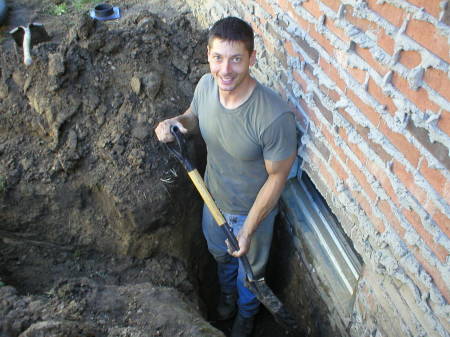 Me, replacing my basement well-windows, Summer of 2005