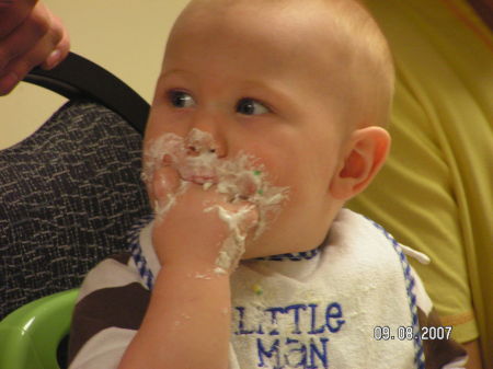 There he is eating his cake