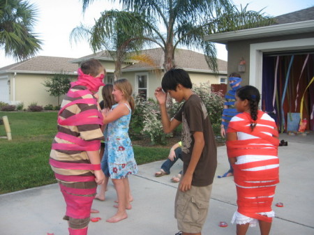 My Son "wrapped like a mummy" at my daughters 10th B-day party, My Daughter is in the blue dress