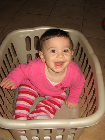 Giana in the basket, at least she is excited to do the Laundry!:)