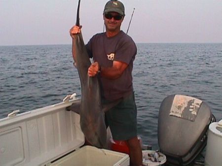 Me on my charter boat "The Reel Thrill" with a shark.