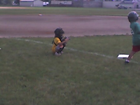 My oldest daughter Kali (8) playing catcher like her dad