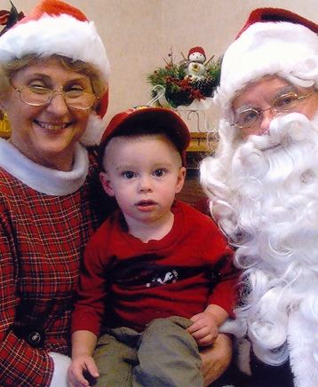 my son, Declan with Santa and Mrs. Claus