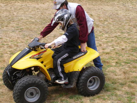 Tris getting instruction on the quad