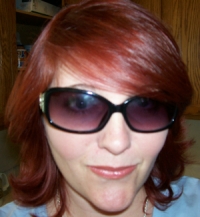 My hair's not so red now- the color fades quick. The first pic is about right.