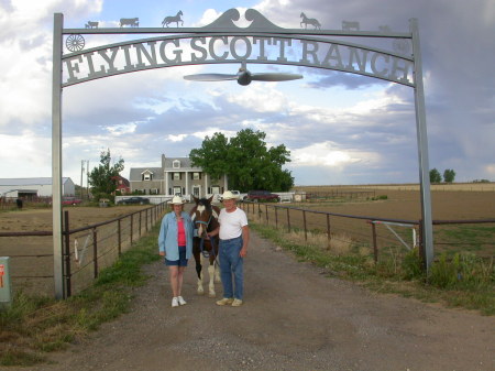 My wife, Judy, and me with Uriah in front of our home, The Flying Scott Ranch in Gill, CO.