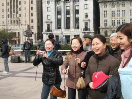 Chinese women taking photos of me in mob scene